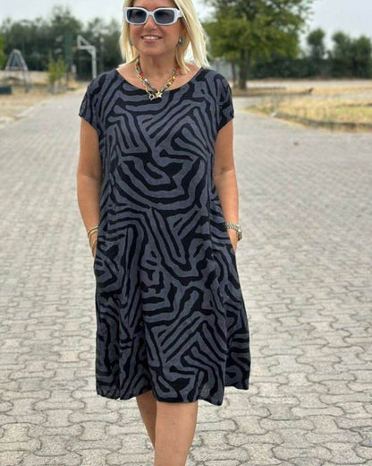 Nelia™ - Summer dress with a round neck and a beautiful print
