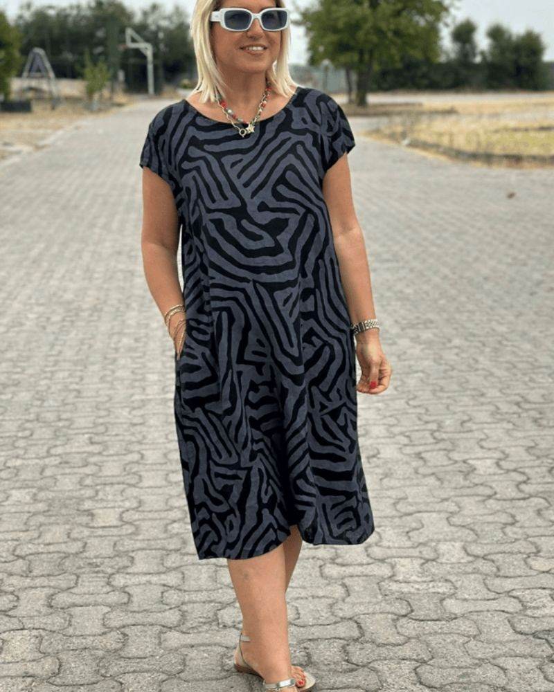Nelia™ - Summer dress with a round neck and a beautiful print