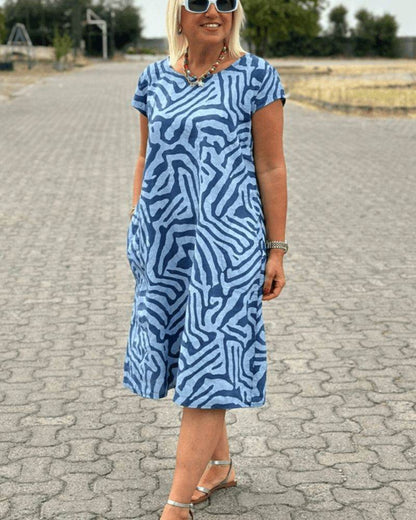 Nelia™ - Summer dress with a round neck and a beautiful print
