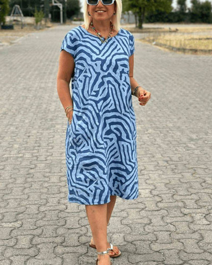 Nelia™ - Summer dress with a round neck and a beautiful print